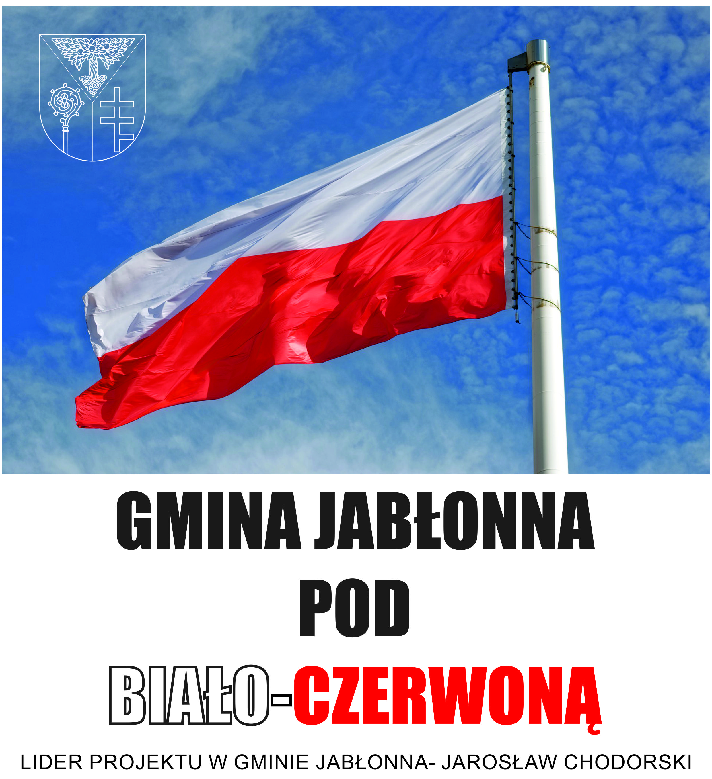 Biało-czerwona flaga na tle błękitnego nieba. Napis: Gmina Jabłonna pod biało-czerwoną. Lider projektu w Gminie Jabłonna- Jarosław Chodorski